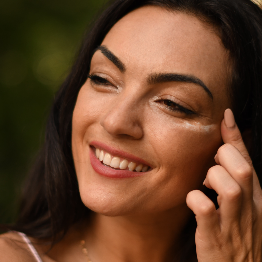 Woman using anti-aging cream for an ageless complexion by Source Vital Apothecary
