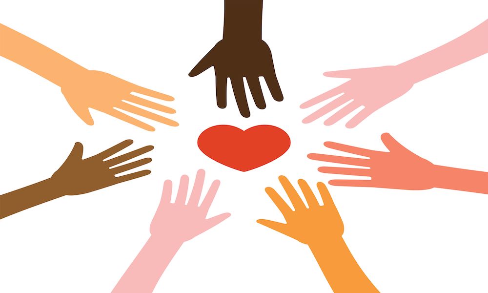 social wellness different colored hands surrounding heart