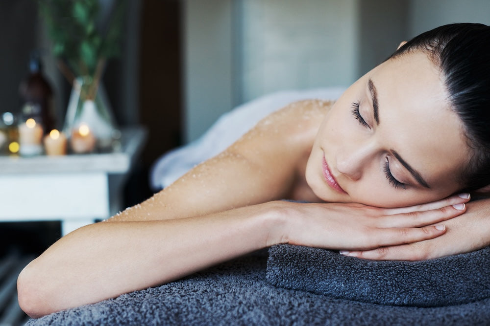 Woman enjoying a spa treatment and laying on her hands