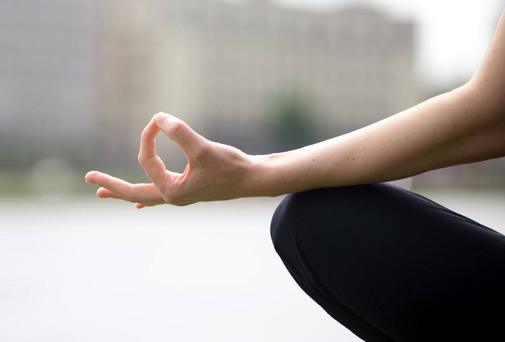 Woman's arm in meditating position
