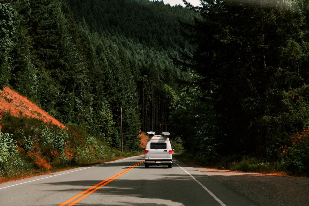 Travel van driving down mountain roads