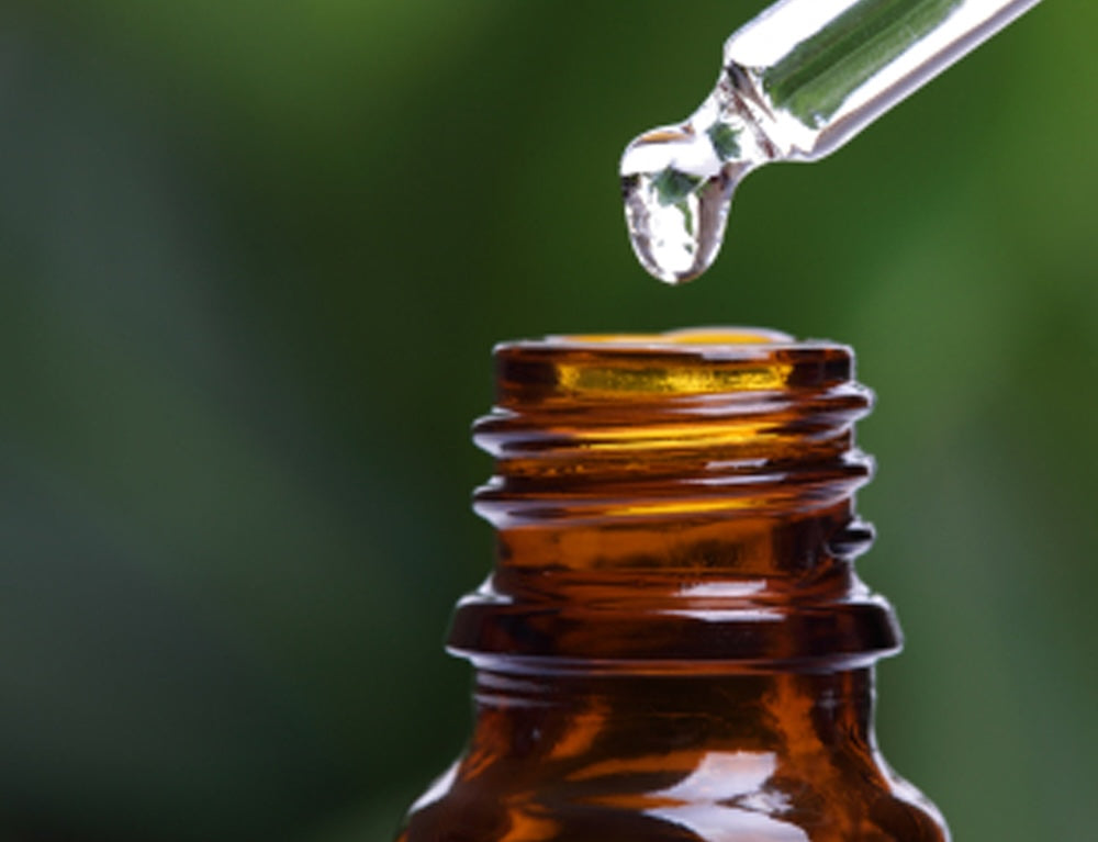 Amber bottle with dropper of oil 