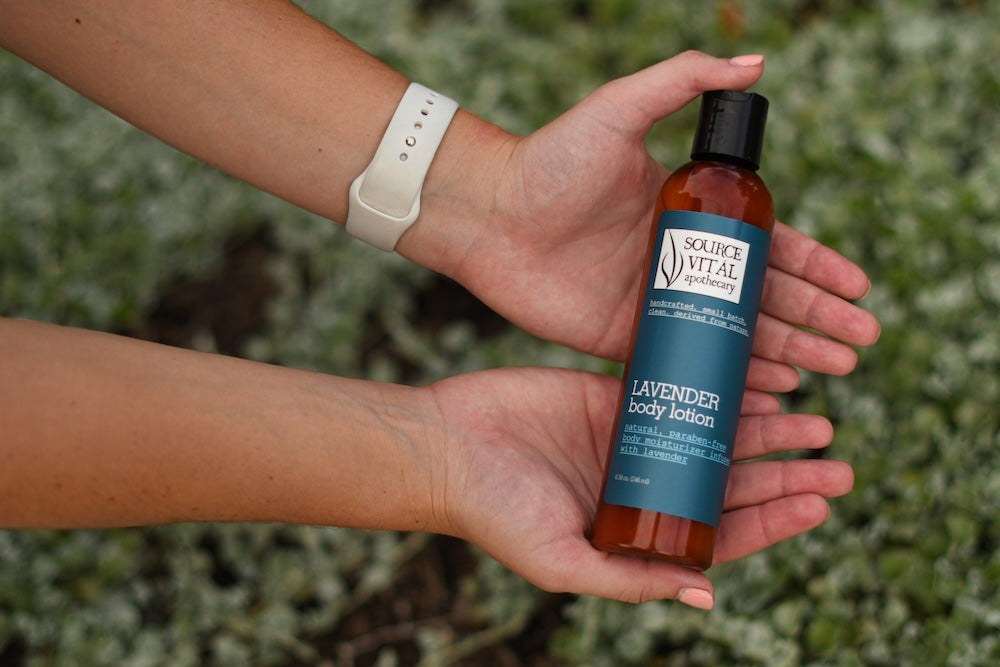 Woman holding Lavender Body Lotion in her palms