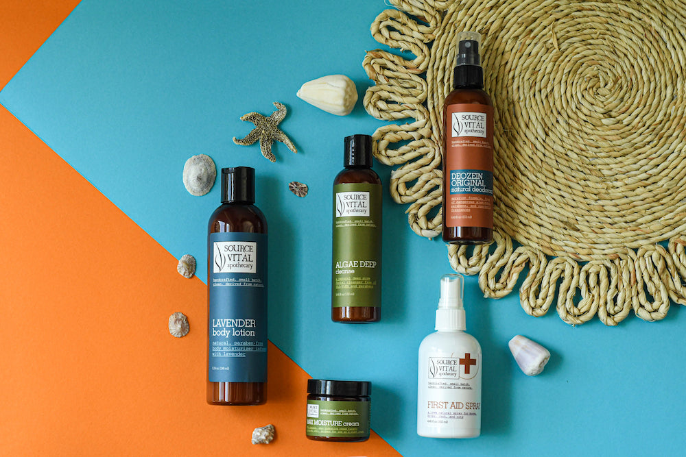 Source Vital's Summertime Essential Products against a colorful background surrounded by shells